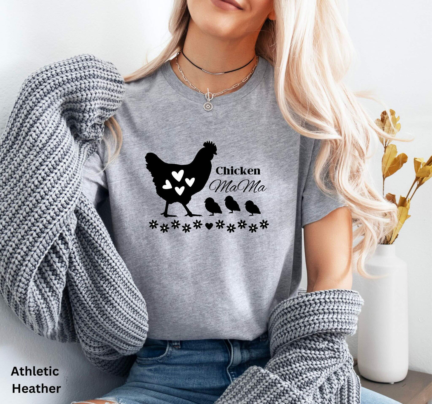 Light grey chicken Mama t-shirt featuring a hen with baby chicks and flowers, perfect for homesteaders, backyard chicken keepers, and farm life lovers.
