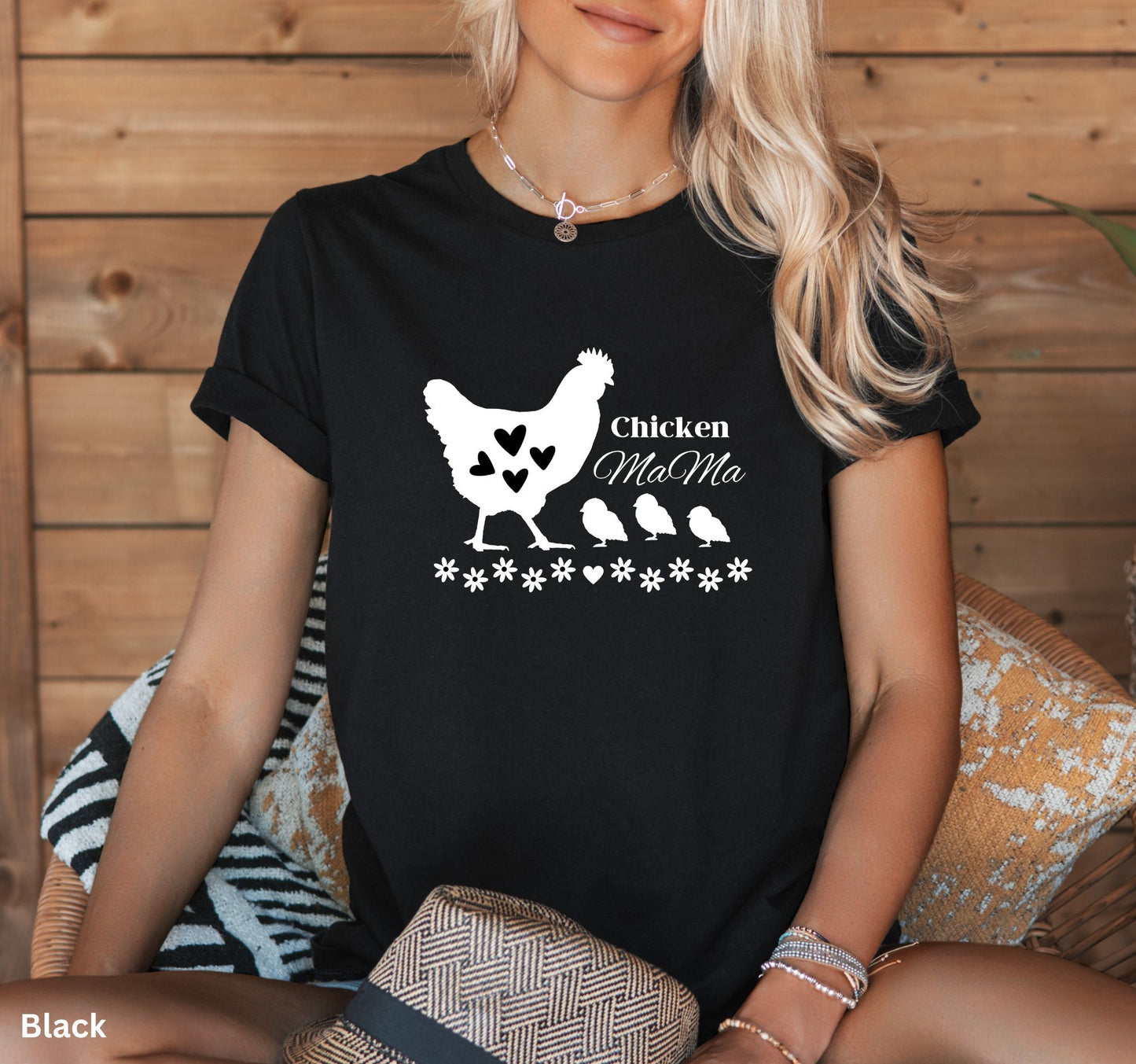 Black Chicken Mama t-shirt featuring a hen with baby chicks and flowers, perfect for homesteaders, backyard chicken keepers, and farm life lovers.
