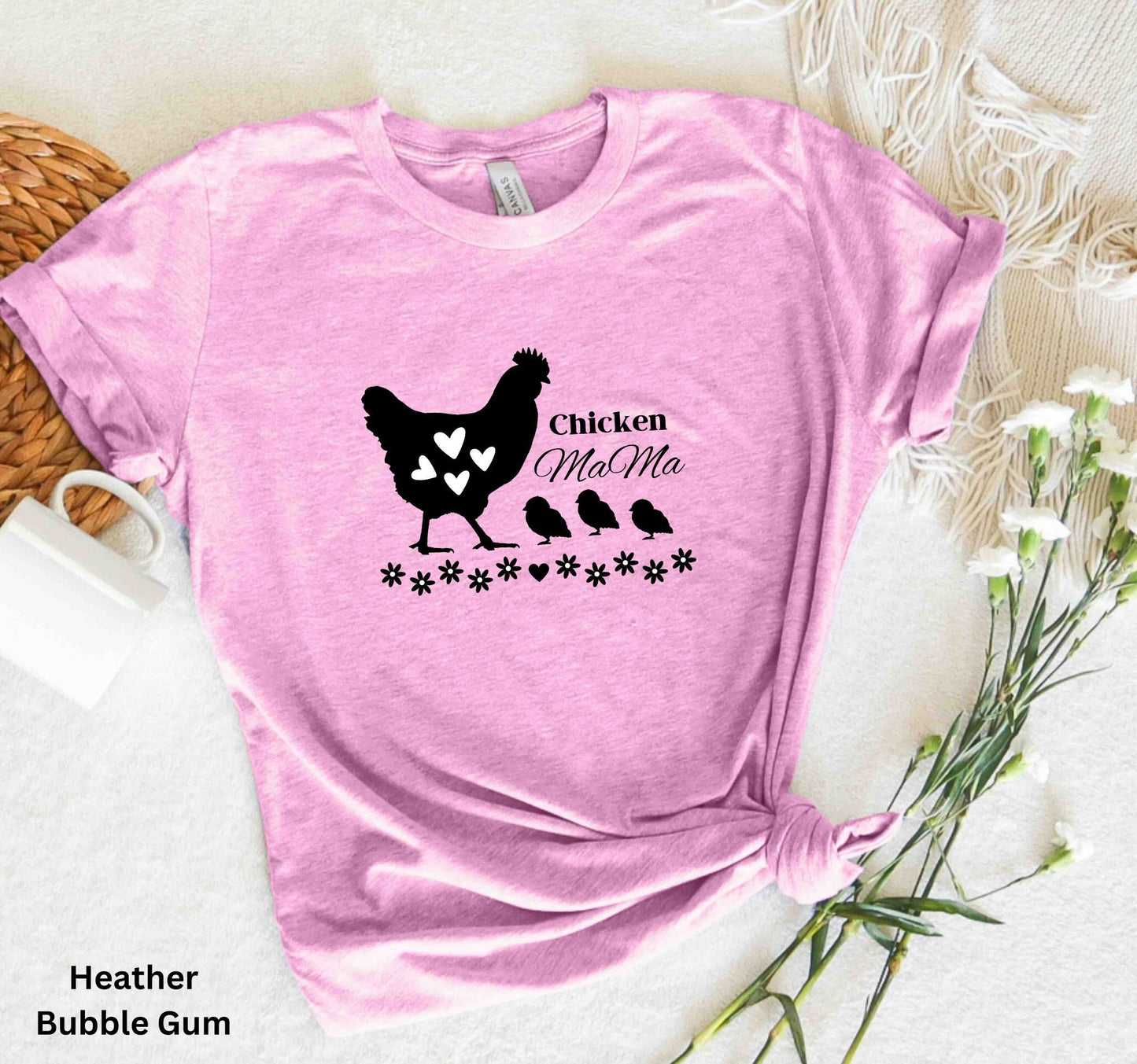 Light Pink Chicken Mama t-shirt featuring a hen with baby chicks and flowers, perfect for homesteaders, backyard chicken keepers, and farm life lovers.