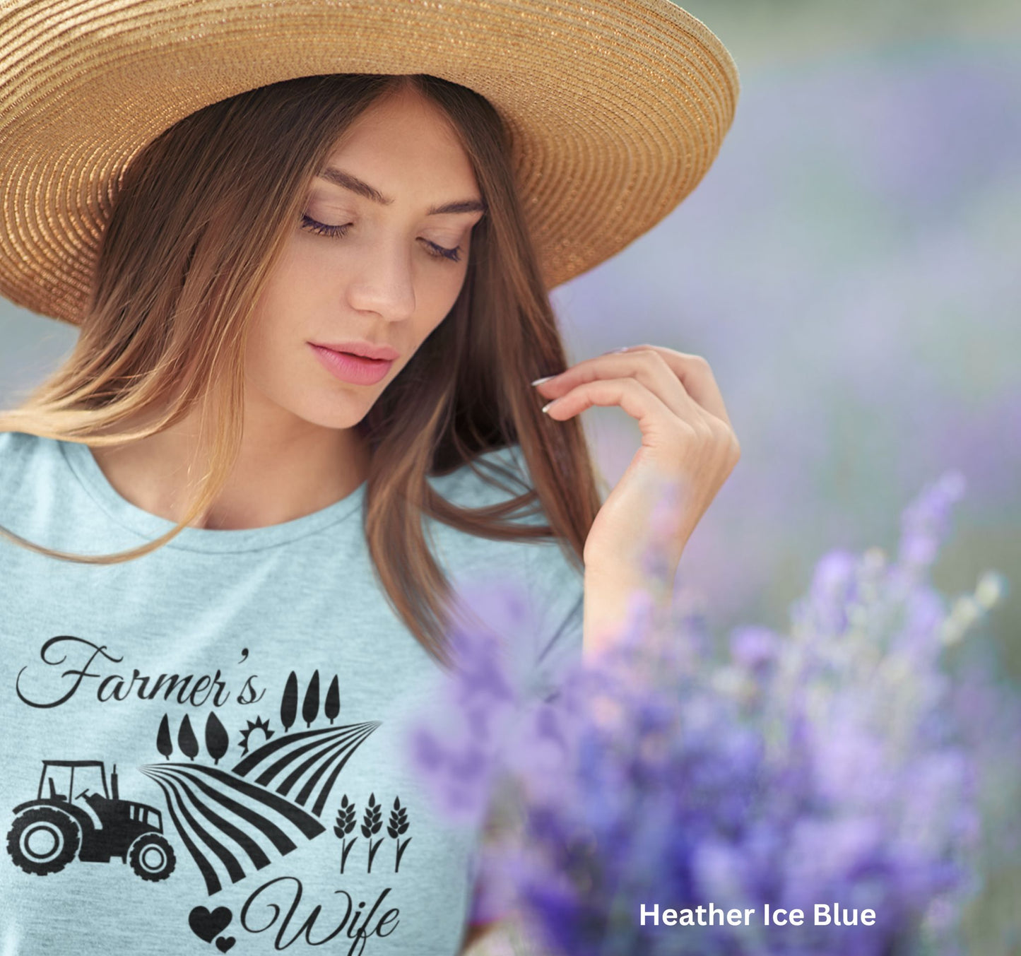 Farmer’s Wife ice blue t-shirt with tractor, wheat field and heart design, celebrating country living and hardworking farm women.