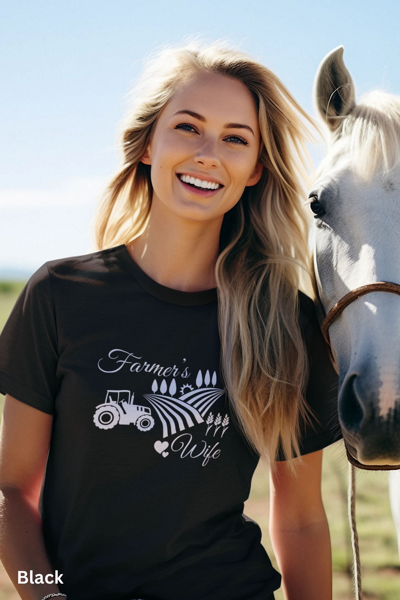 Farmer’s Wife black t-shirt with tractor, wheat field and heart design, celebrating country living and hardworking farm women.