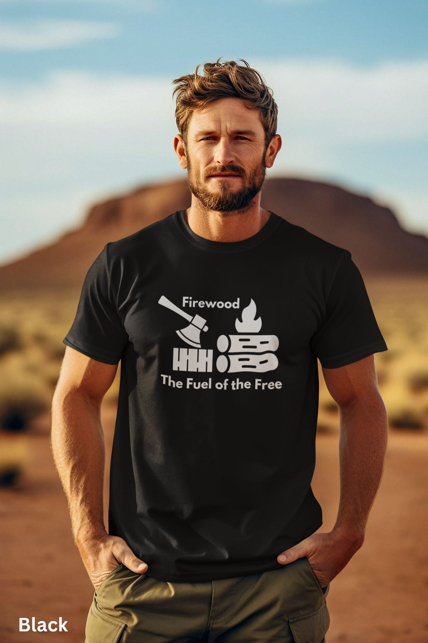 Black T-shirt with the phrase 'Firewood: The Fuel of the Free,' featuring a campfire, stacked firewood, and an ax—perfect for wood heat lovers and homesteaders.