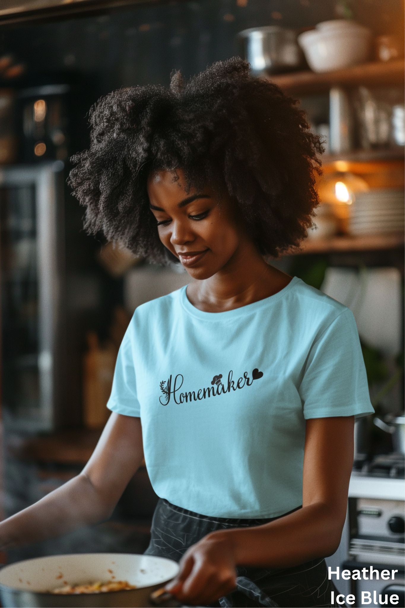 Ice blue homemaker t-shirt with floral design, chef’s hat over the 'A,' and heart accent, perfect for homesteaders, homebakers, and simple living enthusiasts.