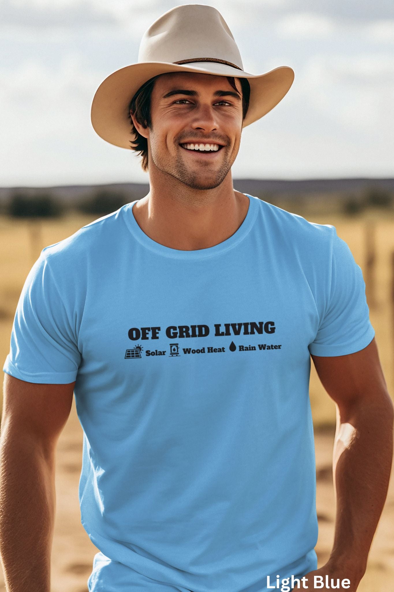 Light Blue Off Grid Living t-shirt featuring the words 'Off Grid Living' with icons representing solar power, wood heat, and rainwater—perfect for self-sufficiency and sustainable living.