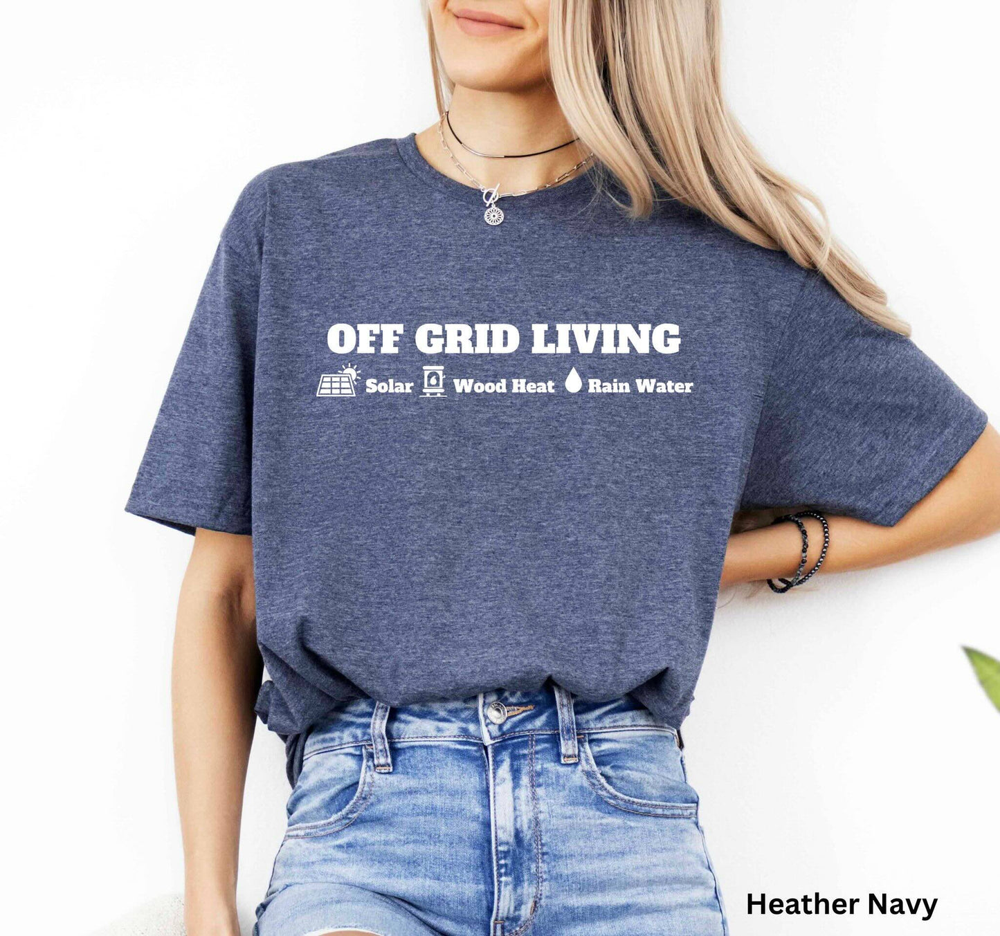 Navy Off Grid Living t-shirt featuring the words 'Off Grid Living' with icons representing solar power, wood heat, and rainwater—perfect for self-sufficiency and sustainable living.