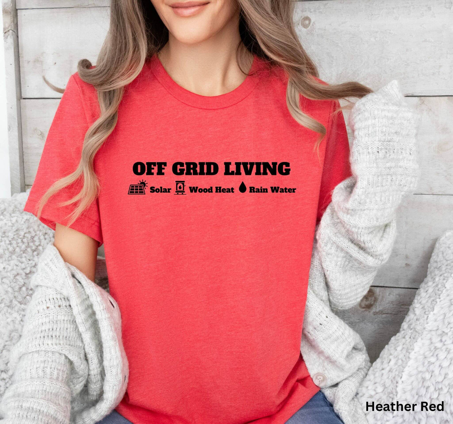 Off Grid Living t-shirt in Red featuring the words 'Off Grid Living' with icons representing solar power, wood heat, and rainwater—perfect for self-sufficiency and sustainable living.