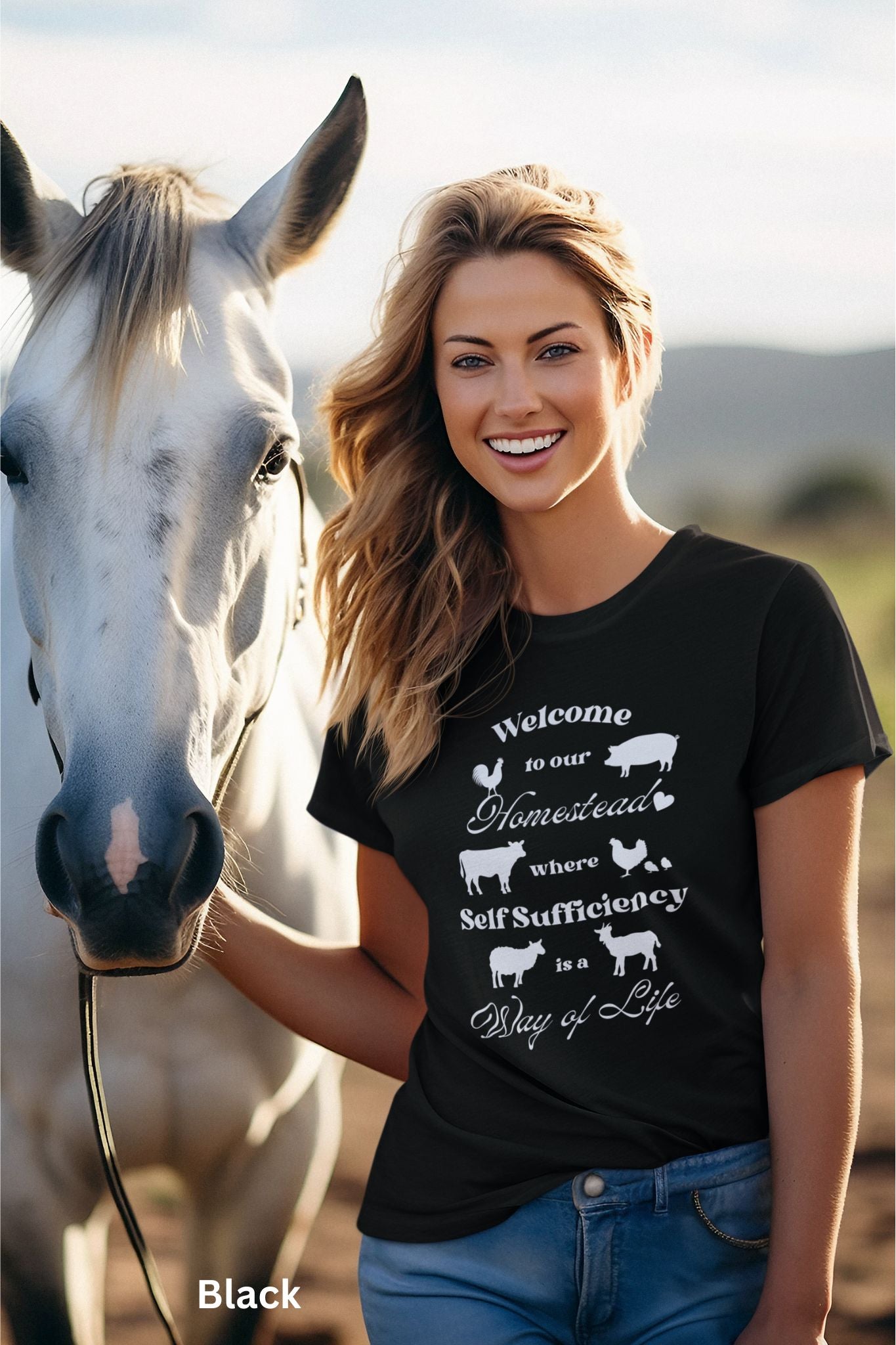Black Homestead t-shirt featuring the phrase 'Welcome to our Homestead where Self-Sufficiency is a Way of Life' with farm animals including a rooster, hen with chicks, pig, cow, sheep, and goat. Perfect for homesteaders and farm life lovers.
