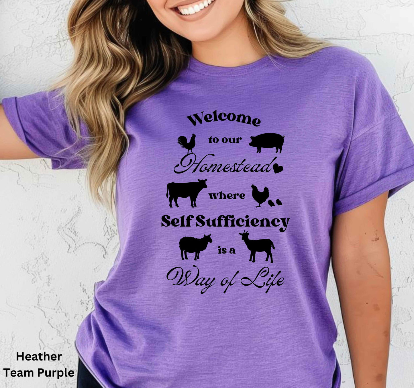 Purple Homestead t-shirt featuring the phrase 'Welcome to our Homestead where Self-Sufficiency is a Way of Life' with farm animals including a rooster, hen with chicks, pig, cow, sheep, and goat. Perfect for homesteaders and farm life lovers.