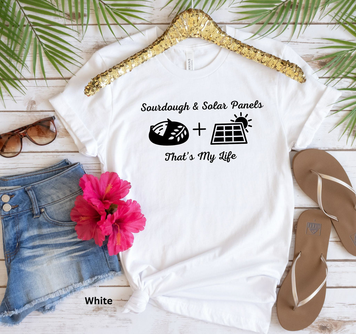 White T-shirt with the phrase 'Sourdough & Solar Panels, That’s My Life,' featuring a loaf of sourdough bread, a solar panel, and the sun—perfect for off-grid living.