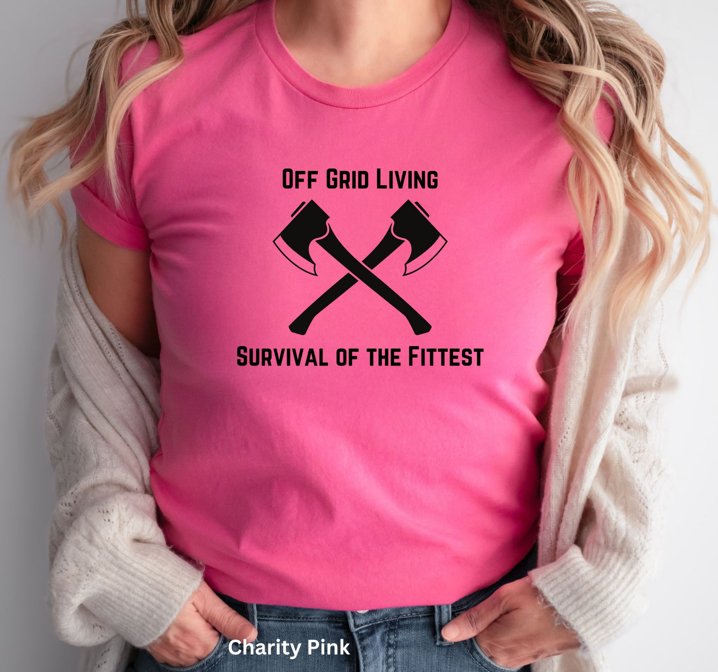 Off Grid Living t-shirt in pink with 'Survival of the Fittest' text and crossed axes design, survivalist and bushcraft graphic tee