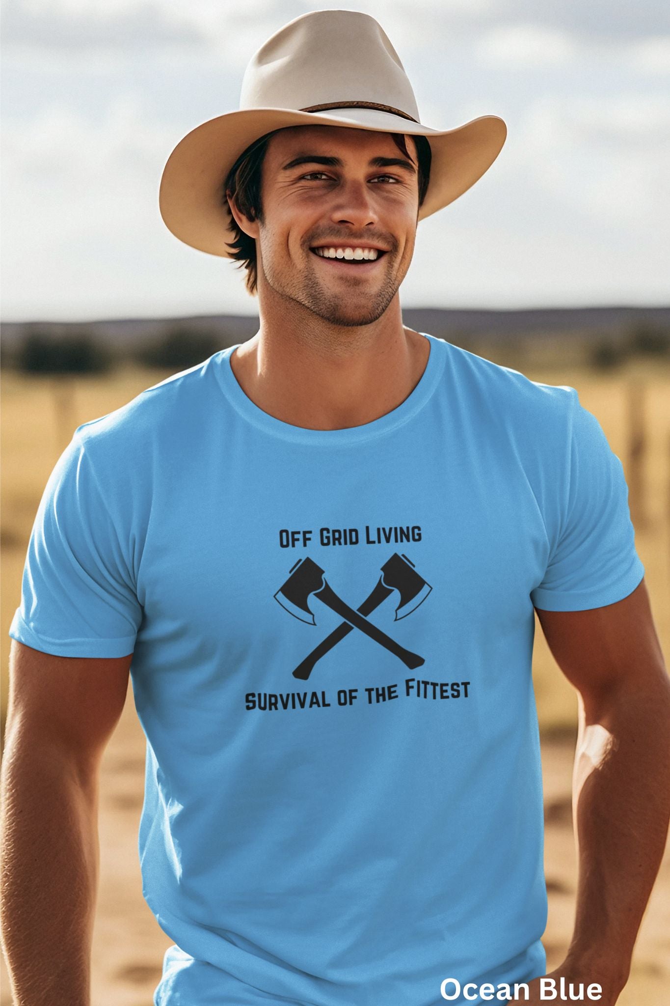 Off Grid Living t-shirt in ocean blue with 'Survival of the Fittest' text and crossed axes design, survivalist and bushcraft graphic tee