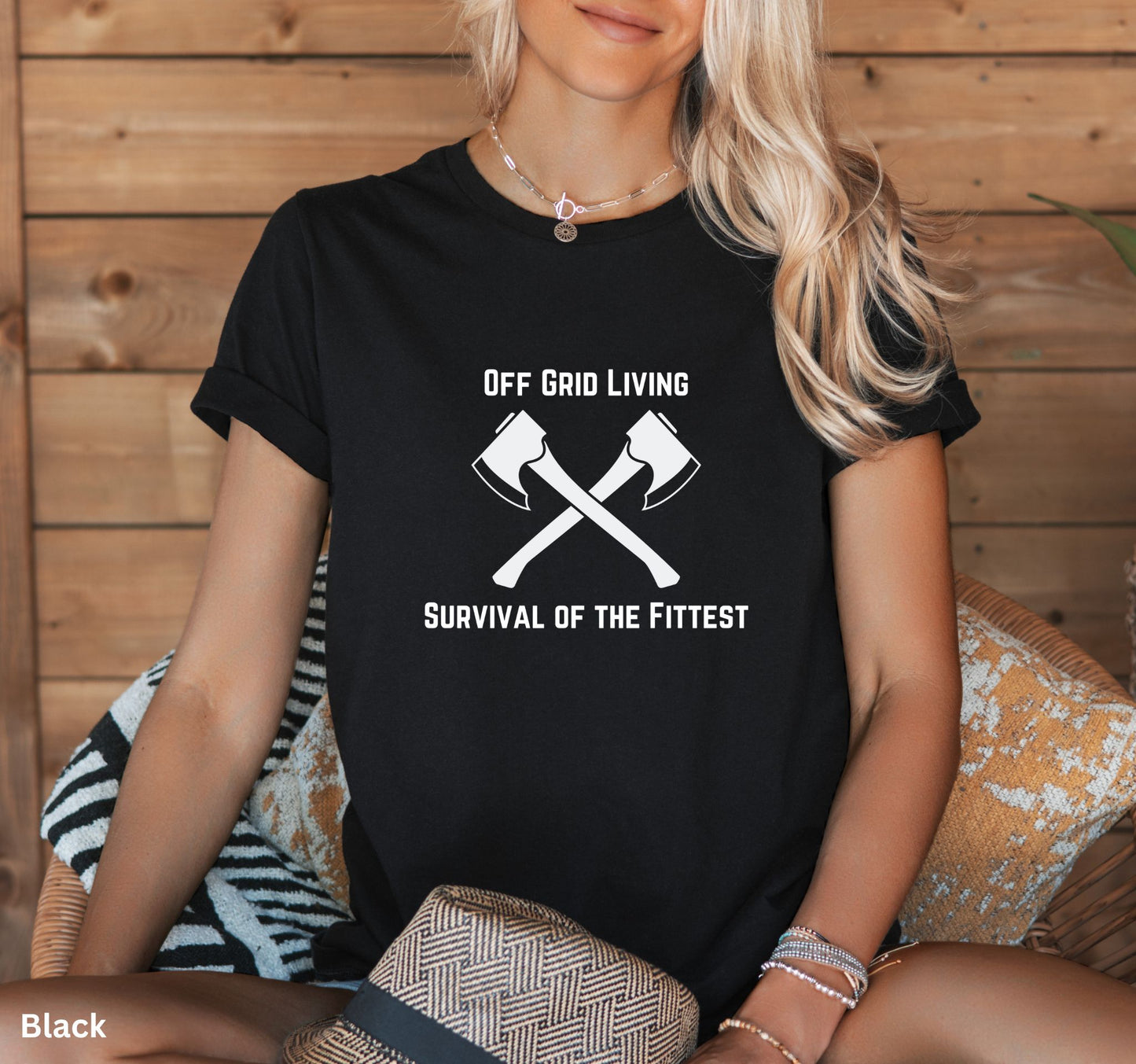 Off Grid Living t-shirt in black with 'Survival of the Fittest' text and crossed axes design, survivalist and bushcraft graphic tee