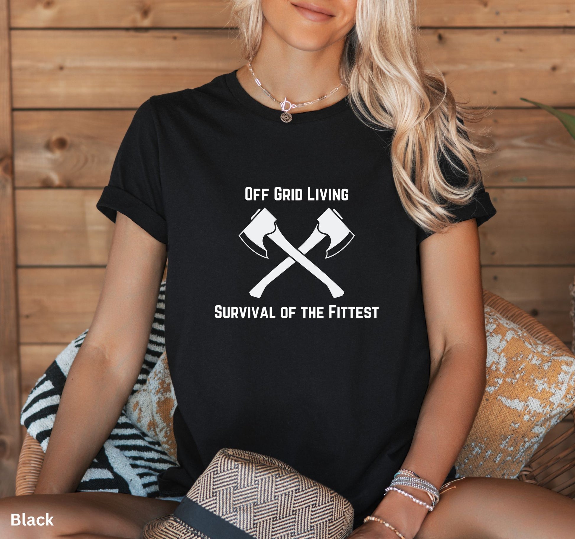 Off Grid Living t-shirt in black with 'Survival of the Fittest' text and crossed axes design, survivalist and bushcraft graphic tee