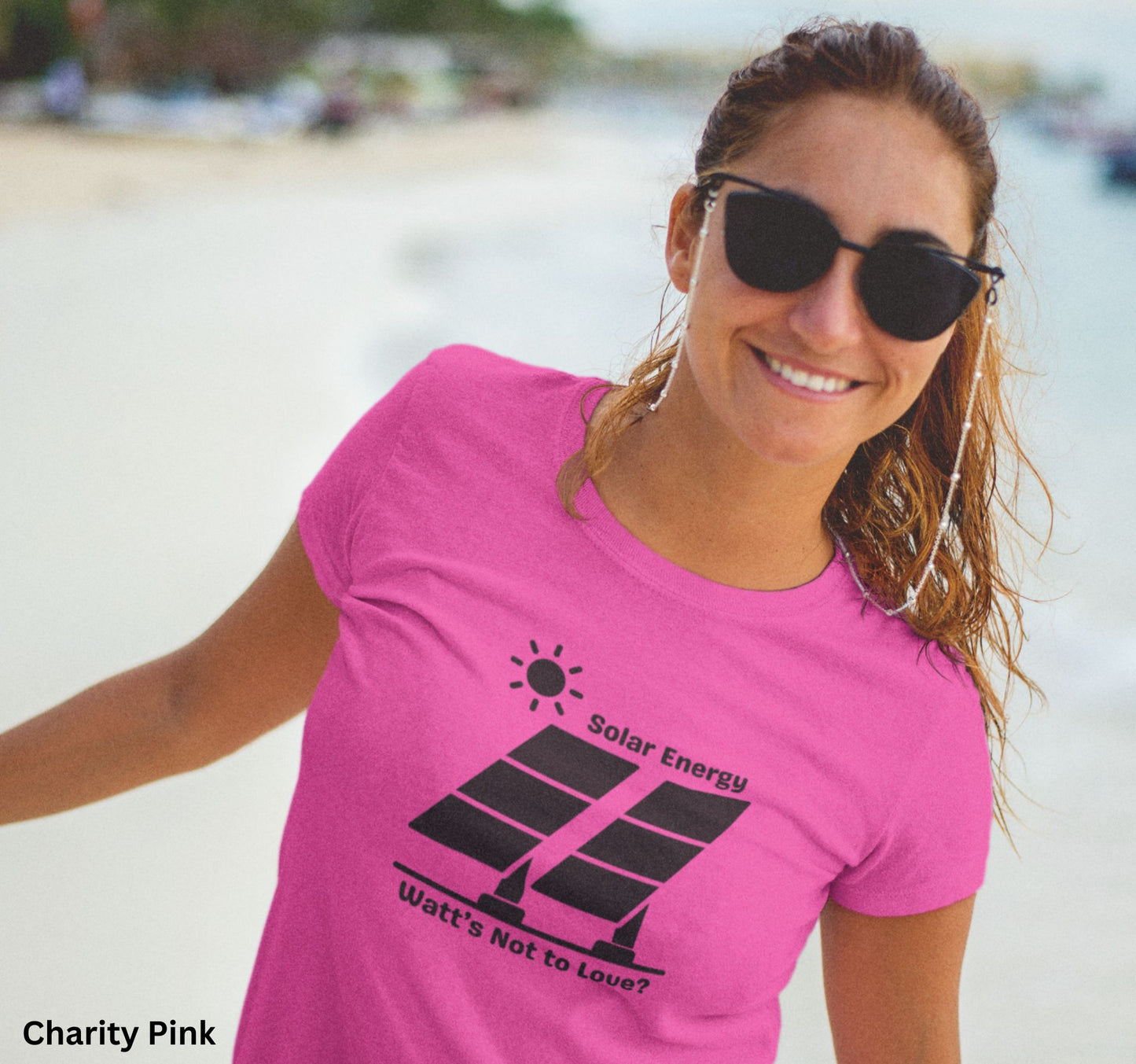Pink Solar Energy t-shirt with design of bright sun and solar panels, featuring the phrase 'Solar Energy. Watts Not to Love?' A fun play on words, perfect for renewable energy enthusiasts and off-grid living.