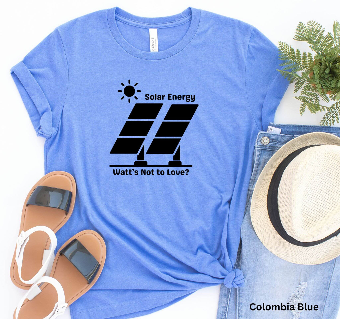 Blue Solar Energy t-shirt with design of bright sun and solar panels, featuring the phrase 'Solar Energy. Watts Not to Love?' A fun play on words, perfect for renewable energy enthusiasts and off-grid living.