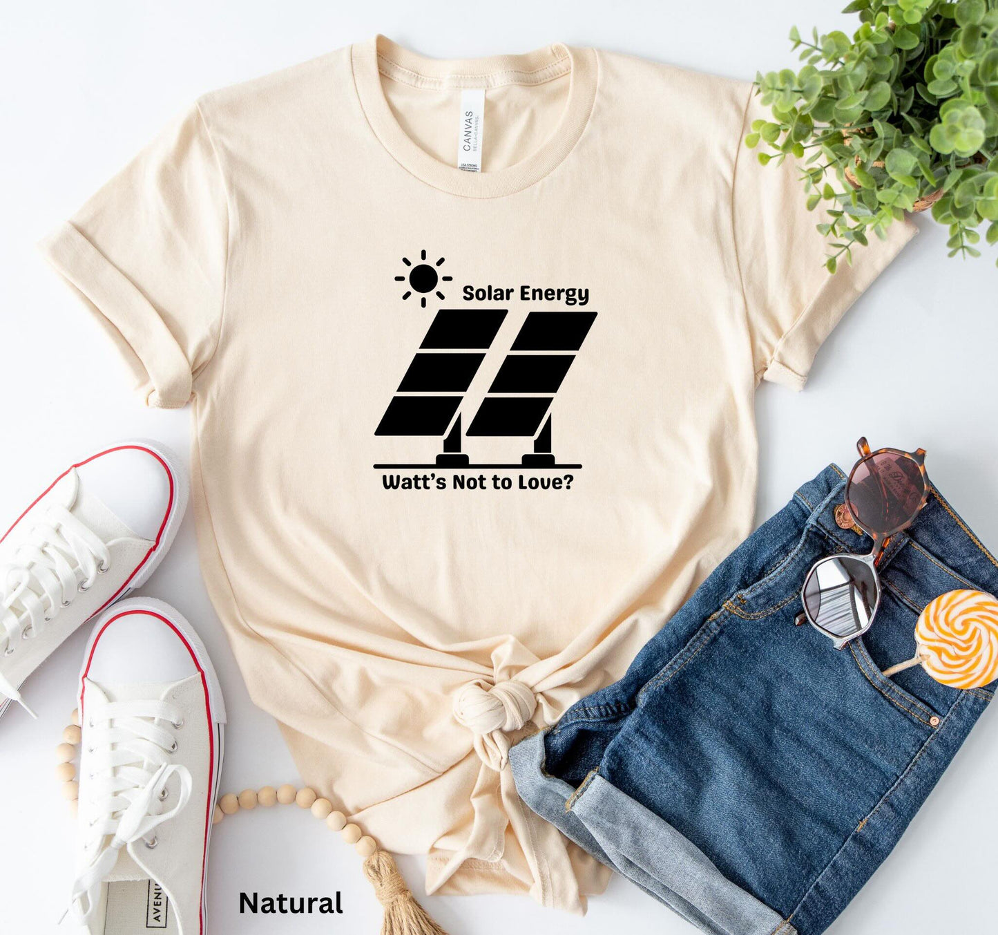 Natural Solar Energy t-shirt with design of bright sun and solar panels, featuring the phrase 'Solar Energy. Watts Not to Love?' A fun play on words, perfect for renewable energy enthusiasts and off-grid living.
