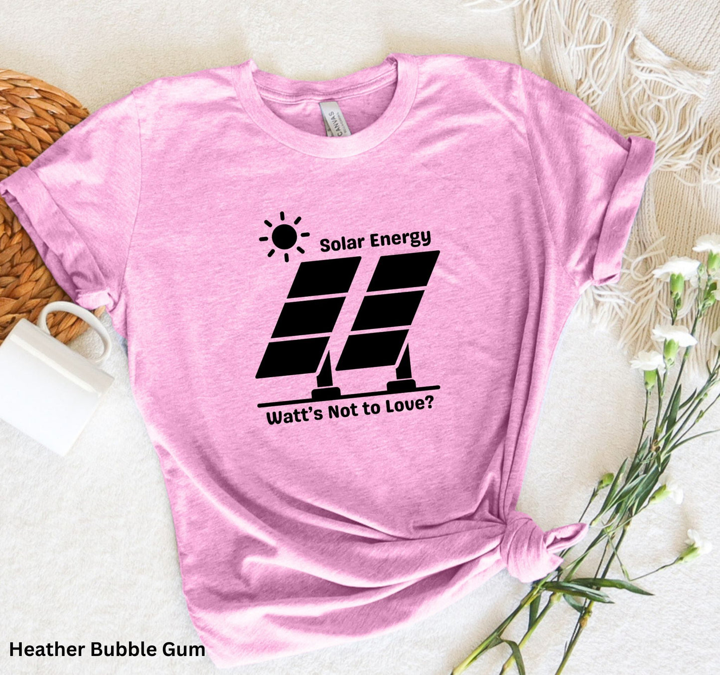 Light Pink Solar Energy t-shirt with design of bright sun and solar panels, featuring the phrase 'Solar Energy. Watts Not to Love?' A fun play on words, perfect for renewable energy enthusiasts and off-grid living.
