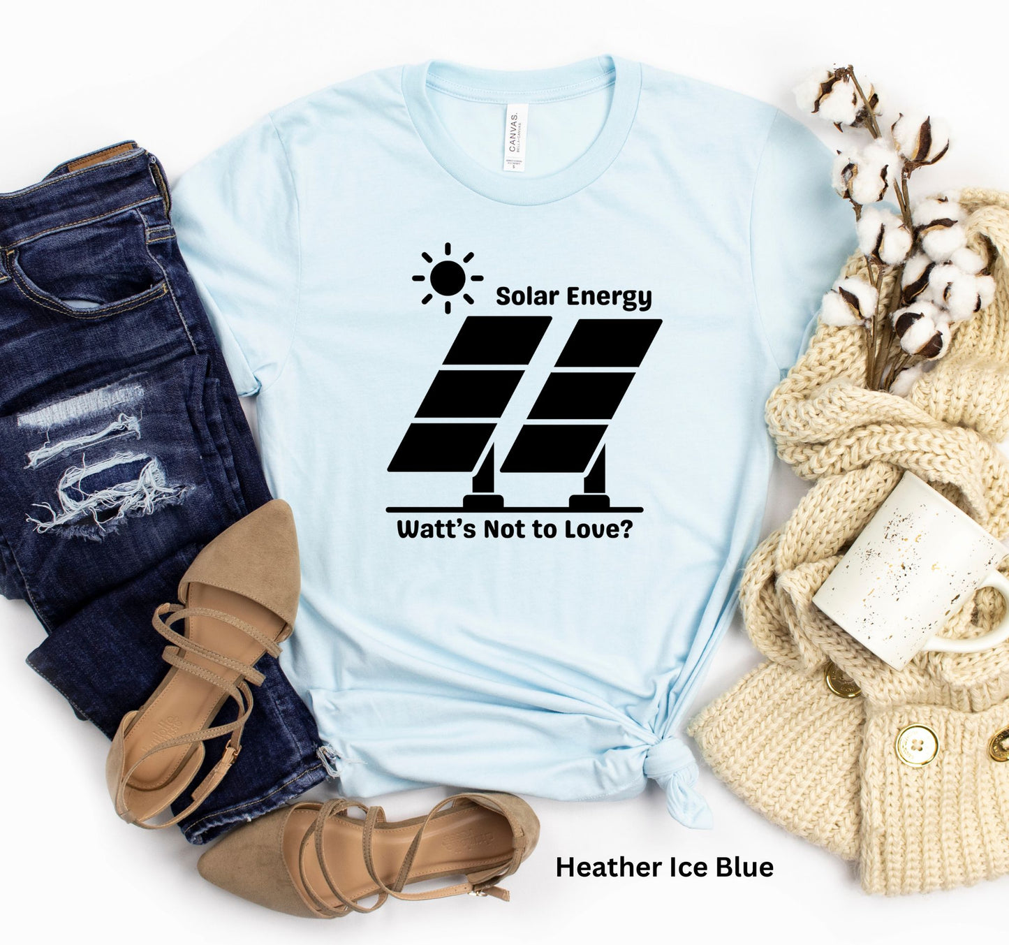 Light Blue Solar Energy t-shirt with design of bright sun and solar panels, featuring the phrase 'Solar Energy. Watts Not to Love?' A fun play on words, perfect for renewable energy enthusiasts and off-grid living.